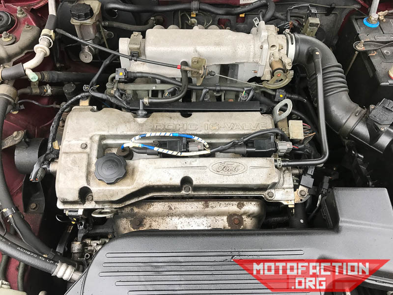Here's how to replace the spark plugs on a Ford Laser KN or KQ with the 1.6L four cylinder ZM engine, as shown on MotoFaction.org. We used NGK 2262 ZFR5F-11 spark plugs.