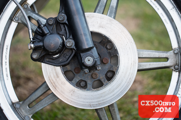 Here's a photo of the single piston front brake caliper setup on a Honda CX500 motorcycle