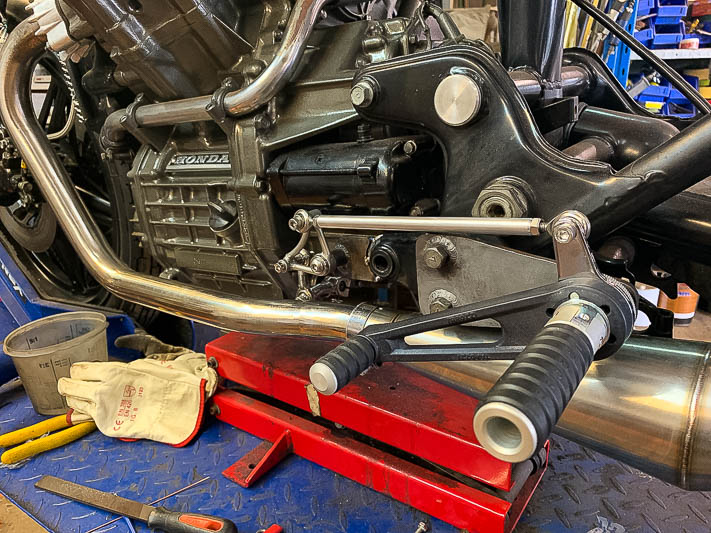 Here's how to install rear sets or move the foot pegs rearward on a Honda CX500 or GL500 Wing cafe racer build.