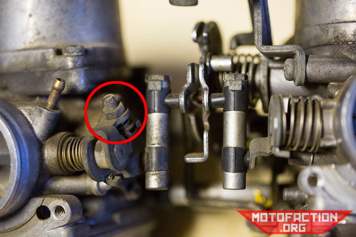 Here's a photo showing the carb sync screw location on a Honda CX650 or GL650 V-twin motorcycle.