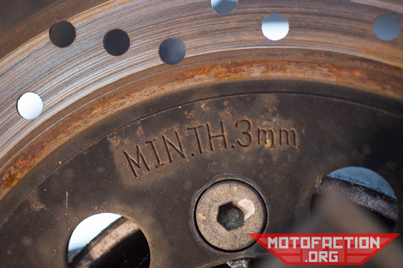 Here's how to check the brake disc or rotor thickness on a Hyosung GT250, GT250R, GT250V motorcycle using digital vernier calipers or a micrometer as shown on MotoFaction.org. These rotors have a ridge at the edge - making it a little harder to check!
